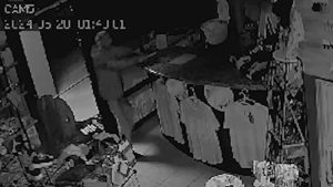 screenshot of surveillance video footage of burglary